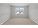 Bright closet with window, shelving, and neutral walls, offering both functionality and style at 10603 Banyan Wood Ct, Indianapolis, IN 46239