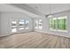 Bright room featuring lots of natural light, wood floors, and access to the backyard at 10603 Banyan Wood Ct, Indianapolis, IN 46239