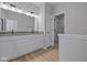 Bathroom with double vanity, modern fixtures, and doorway to walk in closet at 3509 Wrangler Dr, Bargersville, IN 46106
