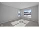 Bright bedroom with neutral walls, plush carpeting, and sunlit windows overlooking the yard at 3509 Wrangler Dr, Bargersville, IN 46106