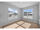 Bright bedroom features two large windows, letting in plenty of natural light and highlighting the luxury vinyl plank flooring at 3509 Wrangler Dr, Bargersville, IN 46106