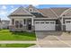 Charming single-Gathering home featuring a two-car garage, stone accents, and a well-manicured lawn at 3509 Wrangler Dr, Bargersville, IN 46106