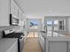 Modern kitchen features stainless steel appliances and large windows offering natural light at 3509 Wrangler Dr, Bargersville, IN 46106