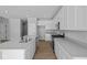 Modern kitchen features stainless steel appliances, granite countertops, and white cabinets at 3509 Wrangler Dr, Bargersville, IN 46106