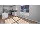 Bright, modern kitchen with stainless steel appliances and ample counter space, next to a large window at 3509 Wrangler Dr, Bargersville, IN 46106