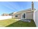 Back exterior view showing patio and private yard at 4702 Amber Wood Ln, Indianapolis, IN 46235