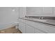 Bathroom featuring a double sink vanity with modern fixtures and a shower/tub combo at 6114 Paperbark Way, Indianapolis, IN 46259