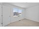 Well-lit bedroom with a large window overlooking an outdoor view at 6114 Paperbark Way, Indianapolis, IN 46259