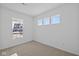 Bright bedroom with neutral carpet, three horizontal windows, and one view window at 6114 Paperbark Way, Indianapolis, IN 46259