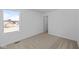 Bedroom with neutral carpet, window, and walk-in closet at 6114 Paperbark Way, Indianapolis, IN 46259
