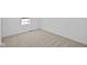Bedroom featuring neutral carpeting, bright lighting, and closet at 6114 Paperbark Way, Indianapolis, IN 46259
