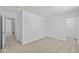 Bright bedroom featuring neutral carpet, white walls, and a walk-in closet entrance at 6114 Paperbark Way, Indianapolis, IN 46259