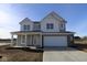 Two-story house with gray siding and a white garage door at 6114 Paperbark Way, Indianapolis, IN 46259