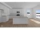 Well-designed kitchen featuring stainless steel appliances, an island, and ample counter space at 6114 Paperbark Way, Indianapolis, IN 46259