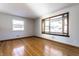 Spacious living room with hardwood floors and bay window at 6137 E Southern Ave, Indianapolis, IN 46203