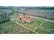 Aerial view of ranch-style home with red roof and fenced yard at 6511 N 550 E, Lebanon, IN 46052