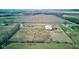 Aerial view of a farm with house, barn, and riding arena at 6511 N 550 E, Lebanon, IN 46052