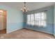 Empty dining room with light blue walls and neutral carpet at 6511 N 550 E, Lebanon, IN 46052