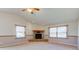 Living room with brick fireplace and vaulted ceiling at 6511 N 550 E, Lebanon, IN 46052