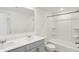 Bright bathroom features double vanity, large mirror, and shower over tub combination at 68 Sterling Pl, New Whiteland, IN 46184