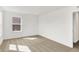 This is a bright bedroom with a large window at 68 Sterling Pl, New Whiteland, IN 46184