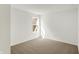 The empty bedroom has neutral carpet and a window at 68 Sterling Pl, New Whiteland, IN 46184