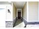 Welcoming entryway with stone accents and a dark wood front door at 68 Sterling Pl, New Whiteland, IN 46184