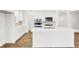 Modern kitchen with stainless steel appliances, an island, and white cabinets at 68 Sterling Pl, New Whiteland, IN 46184