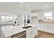 Contemporary kitchen with island opens to the dining room, featuring stainless appliances at 68 Sterling Pl, New Whiteland, IN 46184