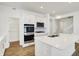 Open-concept kitchen features stainless steel appliances, including double oven at 68 Sterling Pl, New Whiteland, IN 46184