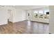 Open living room with hardwood floors, large windows, and outdoor views at 68 Sterling Pl, New Whiteland, IN 46184