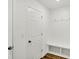 Mudroom with coat hooks, bench, and storage cubbies at 68 Sterling Pl, New Whiteland, IN 46184
