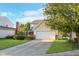 Inviting two-story home with a two-car garage and a well-manicured lawn, curb appeal at 8908 Torrance Pl, Fishers, IN 46038