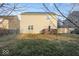 Well-maintained backyard with green grass, wooden deck, and fenced perimeter at 13834 Keams Dr, Fishers, IN 46038