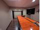 Basement bar with wood countertop and shelving at 13834 Keams Dr, Fishers, IN 46038