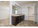 Bright bathroom featuring a double sink vanity with dark wood cabinets and tiled floor at 13834 Keams Dr, Fishers, IN 46038