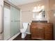 Bathroom featuring a toilet, glass door shower and a wood vanity with granite countertop at 13834 Keams Dr, Fishers, IN 46038