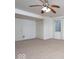 Bright bedroom featuring a ceiling fan, carpet floor, and a pair of closets at 13834 Keams Dr, Fishers, IN 46038