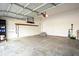 Spacious two car garage with a concrete floor and additional storage at 13834 Keams Dr, Fishers, IN 46038