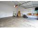 Attached garage with a concrete floor, garage door opener, and utility storage at 13834 Keams Dr, Fishers, IN 46038