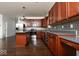 Well-equipped kitchen with stainless steel appliances and dark wood cabinets at 13834 Keams Dr, Fishers, IN 46038