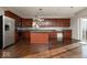 Well-lit kitchen with stainless steel appliances and a large kitchen island for food preparation at 13834 Keams Dr, Fishers, IN 46038