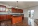 Spacious kitchen featuring hardwood floors, cherry cabinets, and modern appliances at 13834 Keams Dr, Fishers, IN 46038