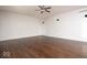Large, open living space with hardwood floors and a ceiling fan at 13834 Keams Dr, Fishers, IN 46038
