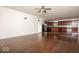 Open-concept living room next to the kitchen with hardwood flooring throughout the space at 13834 Keams Dr, Fishers, IN 46038
