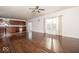 Large, open-concept living room area featuring hardwood floors, a ceiling fan, and natural light at 13834 Keams Dr, Fishers, IN 46038