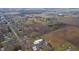 Aerial view showing property location, neighboring houses, and surrounding farmlands at 221 S State St, Markleville, IN 46056