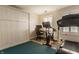 Home gym with treadmill, exercise bike, and built-in closet at 223 N Alabama St, Indianapolis, IN 46204