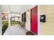 Inviting front porch with red door, bench, and American flag at 231 2Nd Ne St, Carmel, IN 46032