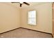 Simple carpeted bedroom with ceiling fan and window at 502 E 9Th St, Sheridan, IN 46069